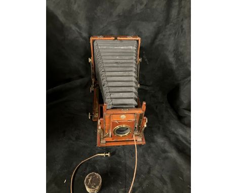 Thornton Pickard Mahogany cased triple expansion camera and lens. Circa 1905-1910 complete with slides, expanding sleeve appe