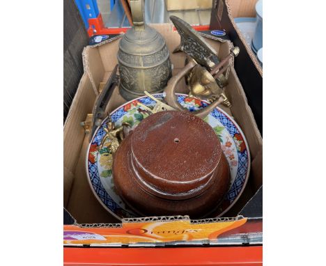 A box of metalware including a brass door knocker, a bell, etc. 