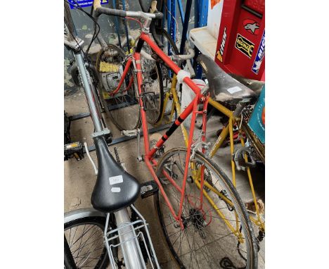 An orange Holdsworth racing bycicle, double chain ring. 