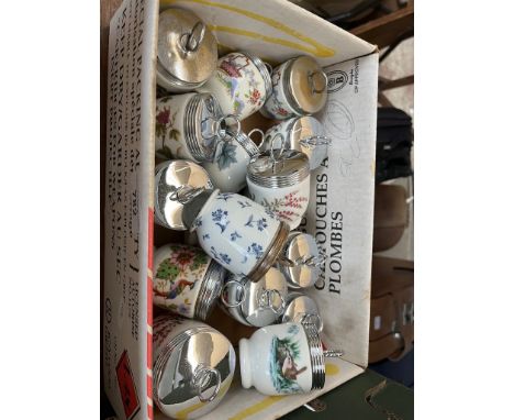 A box of 17 Royal Worcester egg coddlers with various patterns, including floral, blue and white, fruit, oriental, wildlife e