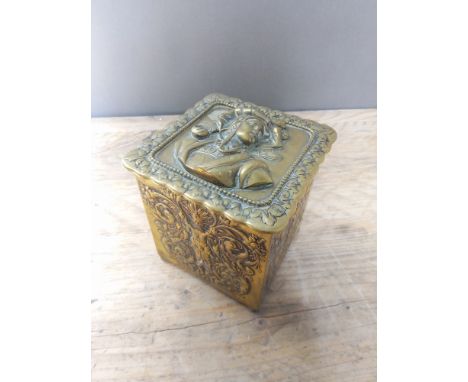 A cast brass tea caddy, height 12cm.