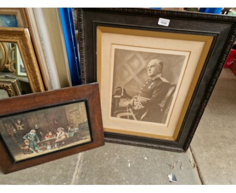 An oak framed print and a military photo. 