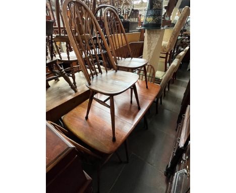 A vintage Ercol elm drop leaf table and five Ercol 'Quaker' chairs. 