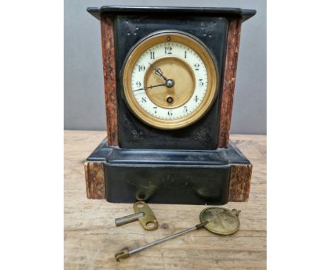 A black slate and marble mantle clock, with gilt and enamel face, pendulum and key.