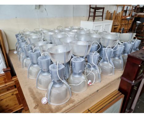 83 industrial light fittings. 