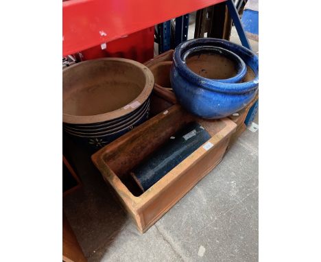 A terracotta trough, 2 square terracotta planters, a terracotta plant pot and 3 glazed plant pots and a vase. 