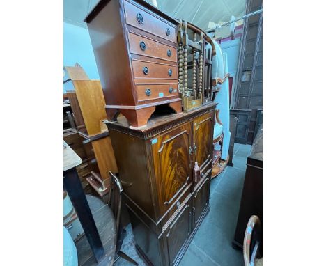 Various items of furniture; a mahogany drinks cabinet, a small mahogany chest of drawers, two nests of tables and a brass sta