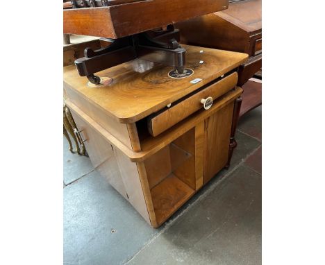 A 1930s Art Deco walnut drinks cabinet with bakelite handles. Condition- some general wear to include surface marks, light sc