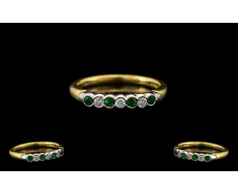 18ct Gold - Attractive Seven Stone Emerald and Diamond Ring. Full Hallmark for 750 - 18 ct. The Emeralds and Diamonds of Exce