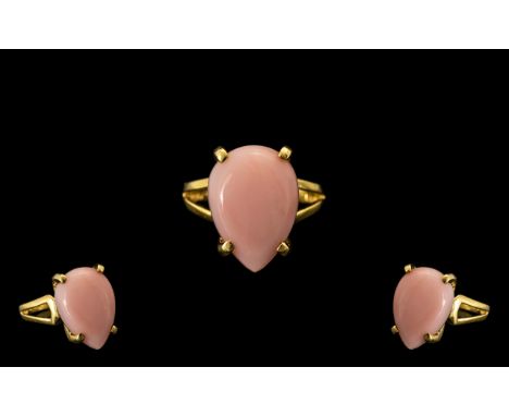 Pink Opal Pear Cut Solitaire Ring, a 7ct cabochon cut pink opal, probably mined in Peru, simply set in 14ct gold vermeil and 