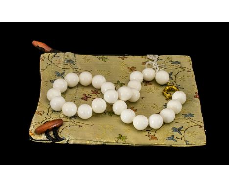 A White Nephrite Jade Beaded Necklace Beautiful set of orange jade nephrite beads from western China, dated 1980. Come with a