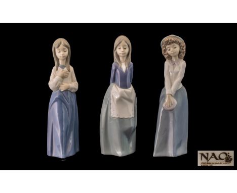 Nao by Lladro Trio of Hand Painted Porcelain Figures ( 3 ) In Total. All Figures of Young Women Wearing Long Dresses, One wit