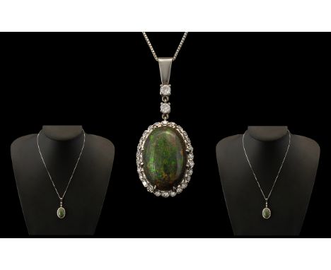 18ct White Gold - Stunning Black Opal and Diamond Set Pendant with Attached 18ct White Gold Chain. Marked 18ct. The Large Aus