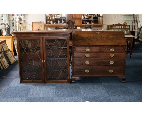 A Large Late Georgian Mahogany Bureau Bookcase the bureau with a fitted interior and pigeon hole compartments with four gradu