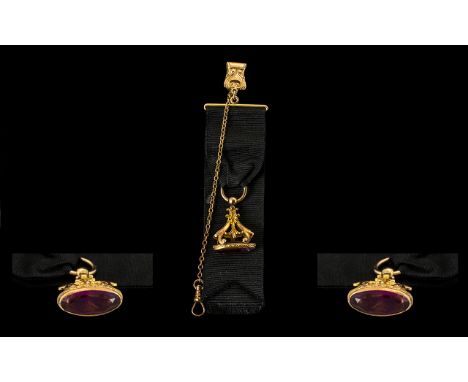 Antique Georgian Pinchbeck Gentleman's Fob on black silk ribbon, with a pocket device attached.  With chain, amethyst stone f