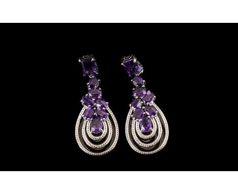 Amethyst Cluster Looped Drop Earrings, 10cts; a pendant cluster of oval cut deep purple amethysts holding three decorative lo