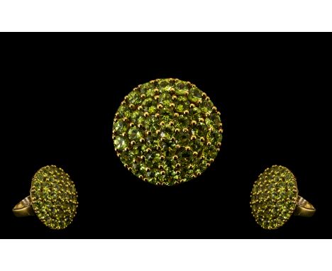 Peridot Circular Cluster Ring, 11cts of graduated, round cut, bright sparkling peridots in three closely set circles, around 