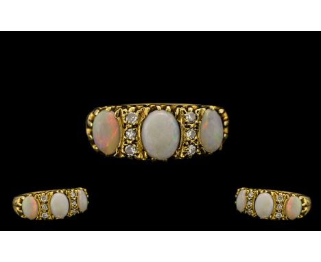 Victorian Period - Superb 3 Stone Opal and Diamond Set Dress Ring. c.1880, Marked 18ct to Interior of Shank. The Opals of Ple