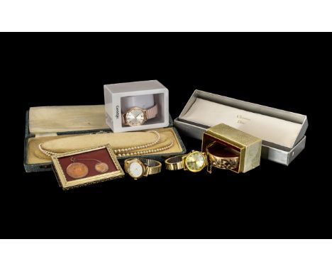 Collection of Three LadiesContemporary Watches on expanding bands, including an engraved bangle with a safety chain, and a bo