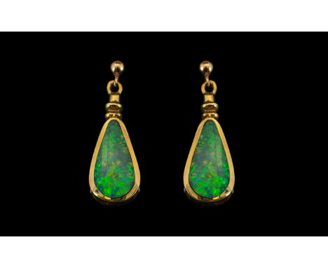 A Pair of 9ct Gold Opal Drop Earrings of triangular form. The opals approximately 14 by 7mm. Fully hallmarked. Gross weight 4