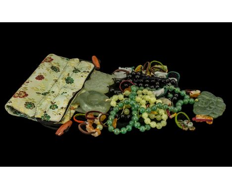 Three Jade Flower Pendant Necklaces with silk cord and back detail and Chinese. PALE ORANGE JADE FLOWER PENDANT WITH COPPER S