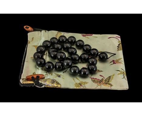 A Black Nephrite Jade Beaded Necklace Beautiful set of black jade nephrite beads from Western China, dated 1980. Comes with a
