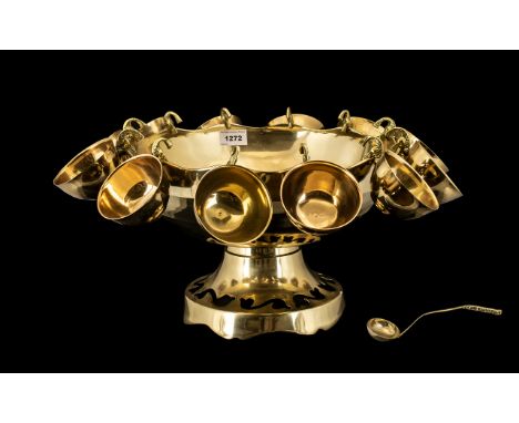 Large Brass Footed Punch Bowl with matching ladle and twelve cups; bowl 13 inches in diameter x 9 high