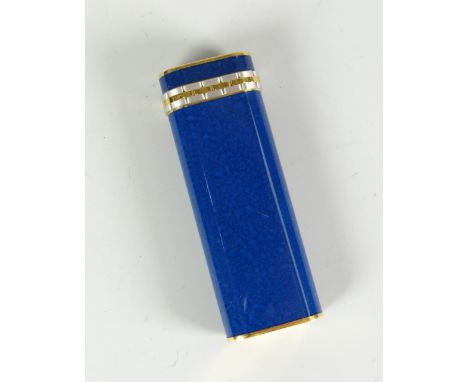 A Cartier blue enamel and white / yellow metal decorated cigarette lighter No.70560 Condition reports provided on request by 