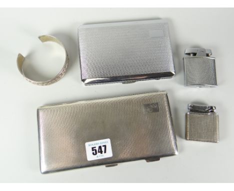 A machine-turned silver cigarette-case with monogrammed cartouche, a chromium similar and two lighters and silver bangle     