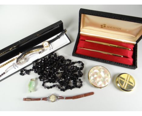 A cased pair of modern quality Sheaffer pens, two compacts,  four modern ladies wristwatches, jade pendant and two strands of