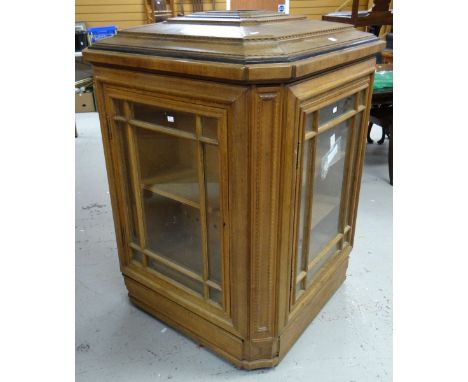 An imposing vintage floor standing mixed wood humidor cabinet, square based and having four glazed doors to each side, of arc