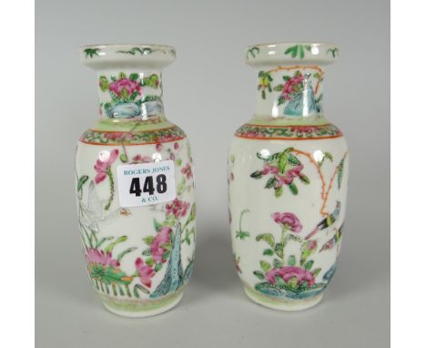 A pair of Famille Rose baluster vases, enamel decorated with flora and fauna, 15cms high Condition reports provided on reques
