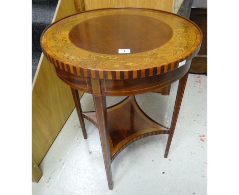 An Edwardian inlaid and painted circular top occasional table with shaped lower tier shelf on tapered supports, 51cms diam Co