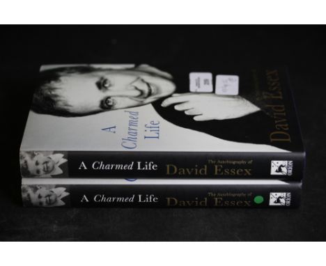 Essex [David], two copies of A Charmed Life, both signed first editions
