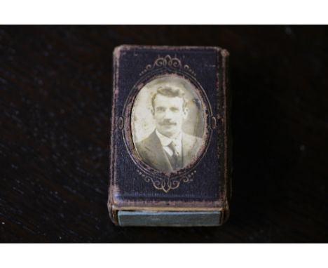 Early 20th century cloth match box case, inset with miniature portrait, worded to side 'Jack James, Newport', containing More