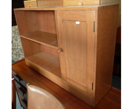 Light oak bookcase with single cupboard