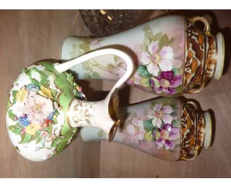 Pair of vases with hand painted decoration and small candlestick with applied flowers