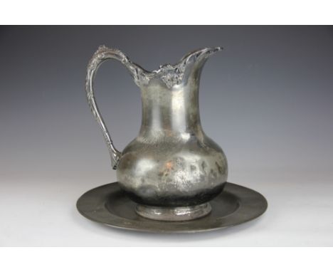 A 19th century Reed & Barton pewter pitcher, 31cm H, with a pewter plate, 34cm diameter (2)