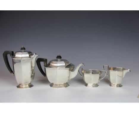 A silver four piece tea service, Mappin and Webb, Sheffield 1945, each piece of pedestal octagonal form and with reeded rims,