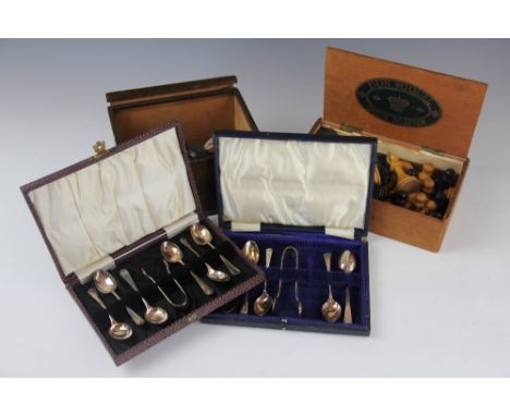 A cased set of six silver teaspoons and matching tongs, Birmingham 1915, a part set of silver teaspoons and tongs, a Parker 5