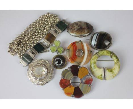 A collection of assorted Scottish hard stone jewellery, to include; a flower head brooch, a six panel set bracelet, seven fur