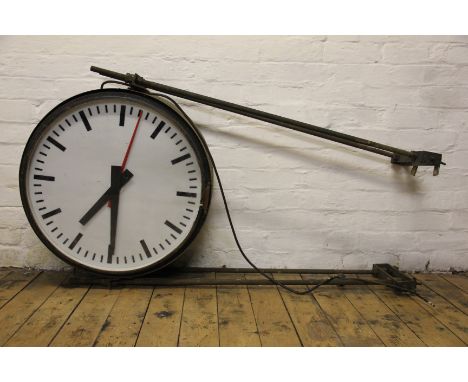 A large double sided station clock formerly from Shrewsbury Station, Shropshire, each 59cm perspex dial with a glass front an