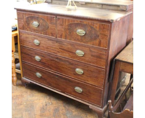 A Regency inlaid mahogany chest with hinged top over two dummy drawers and three graduated long drawers on ogee bracket feet,