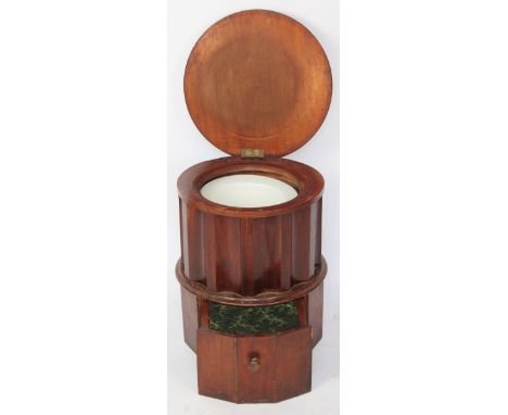 A Victorian walnut commode stool, of circular form with base drawer, 47cm H