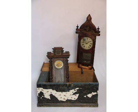 A Victorian stained pine trunk, enclosing two wall clocks (as found)