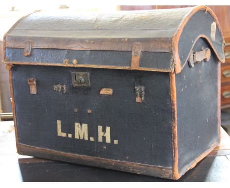 A vintage leather mounted dome top travelling trunk, with internal tray, 63cm H x 78cm W