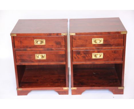 A pair of modern stained beech bedside chests, purchased from Laura Ashley, each with two drawers above a shelf, on bracket f