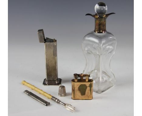 A George V silver mounted decanter and stopper, of pinched form, Birmingham 1924, 18cm, with a silver plated Dunhill Tallboy 