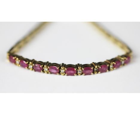 A ruby and diamond set bracelet, designed as nine oval rubies, each interspersed with a brilliant cut diamond, all set in yel