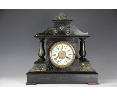 An Edwardian ebonised and painted eight day mantel clock, with Roman numeral chapter ring and movement striking on a gong, 47
